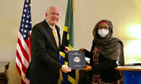United States Ambassador to Tanzania, Dr. Donald Wright presents a grant from the U.S. Ambassadors Fund for HIV/AIDS Relief (AFHR) to Asina Ali Shenduli of BAKWATA National HIV/AIDS Program. - PEPFAR Photo